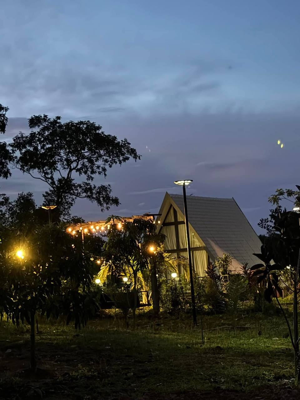 A-Frame house in the evening lights