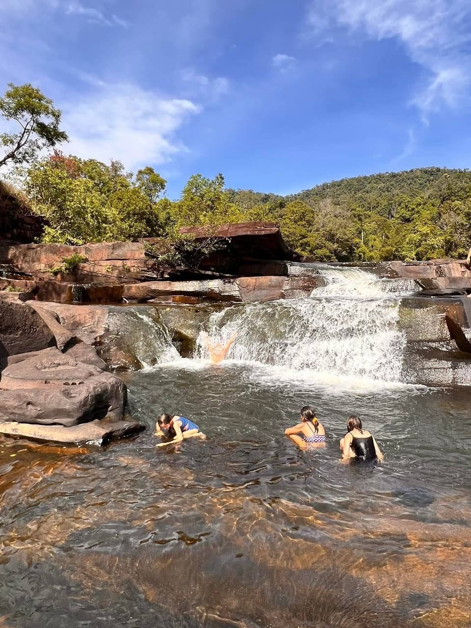 Swimming at the waterfall nearby